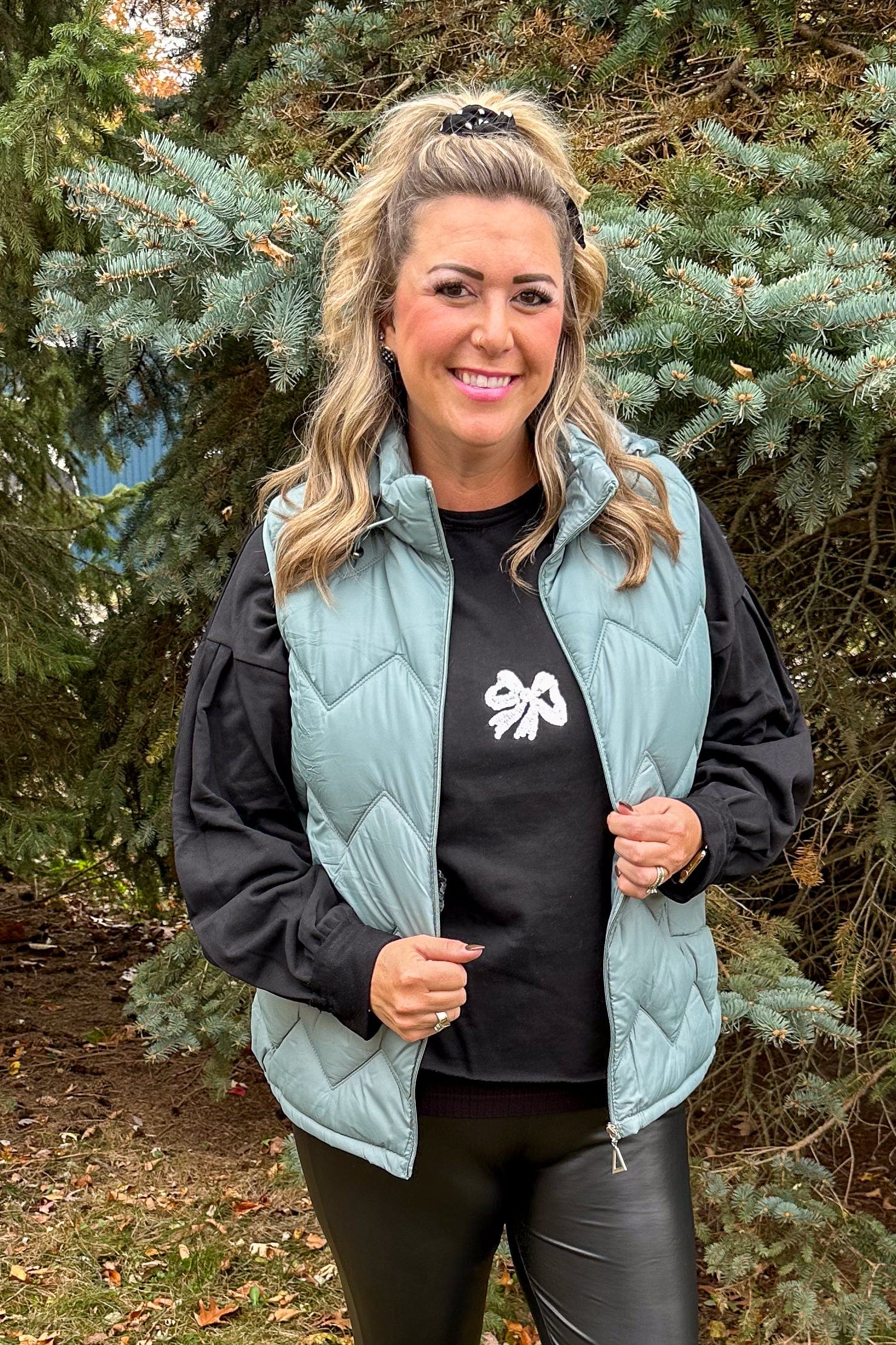 Black Glitter Bow Pullover styled with vest