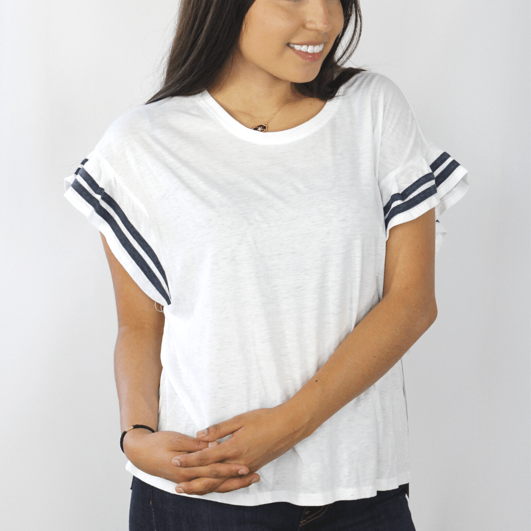 White short sleeve ruffle shirt with navy accents