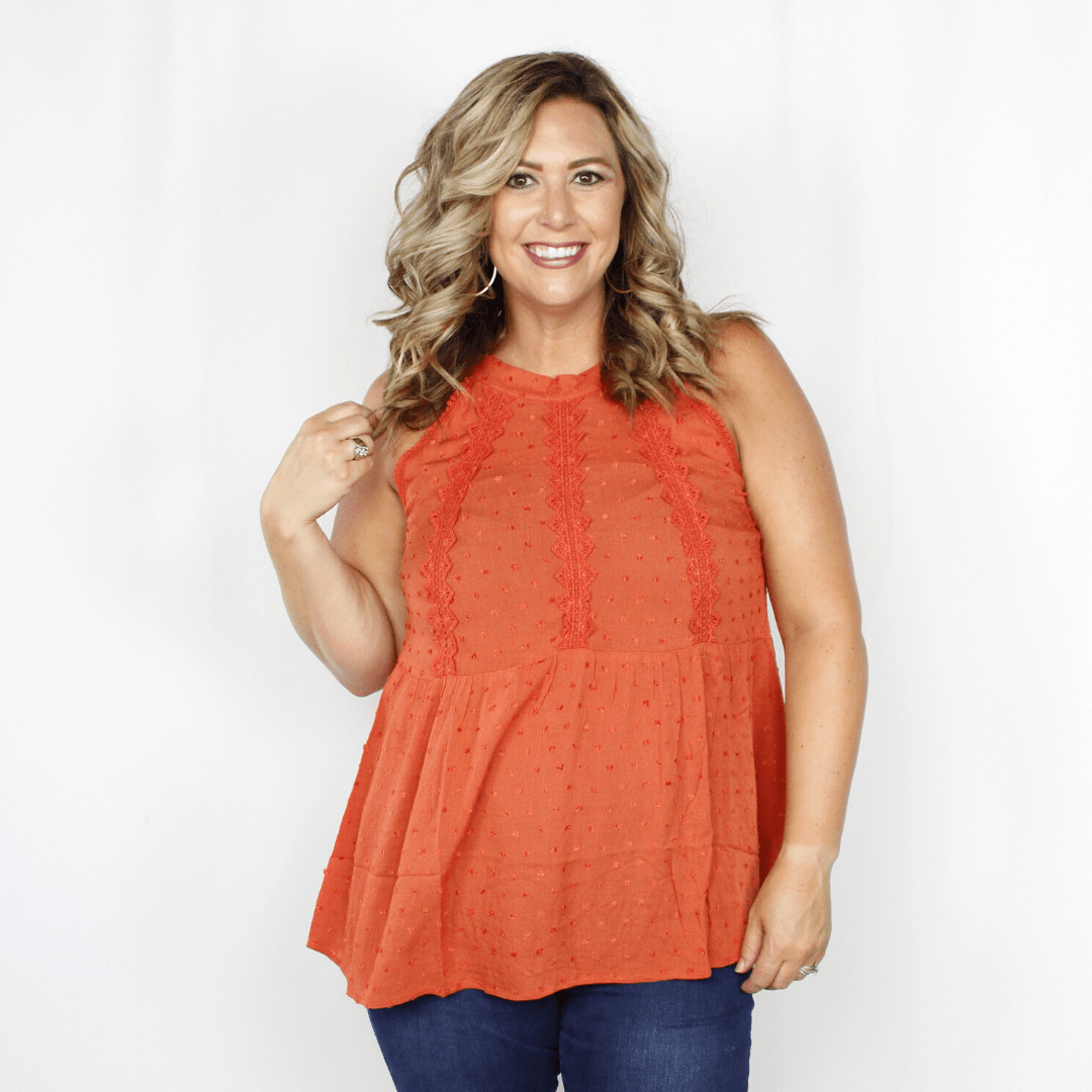 Orange tank top with lace detail and peplum waist