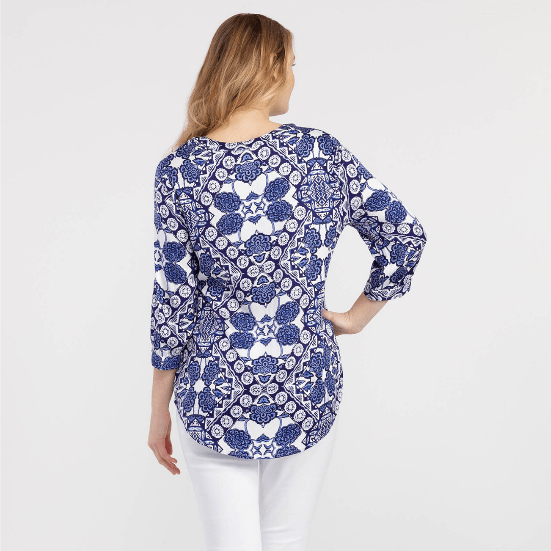 Blue and white pattered blouse, 3/4 length sleeve, tassel accent
