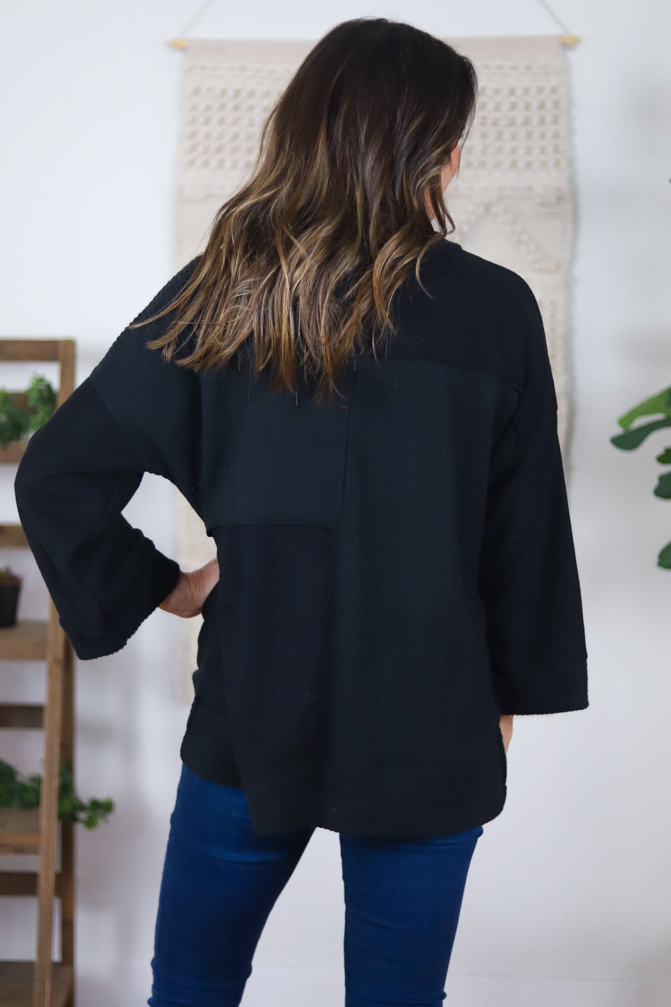 black v-neck with textured patches