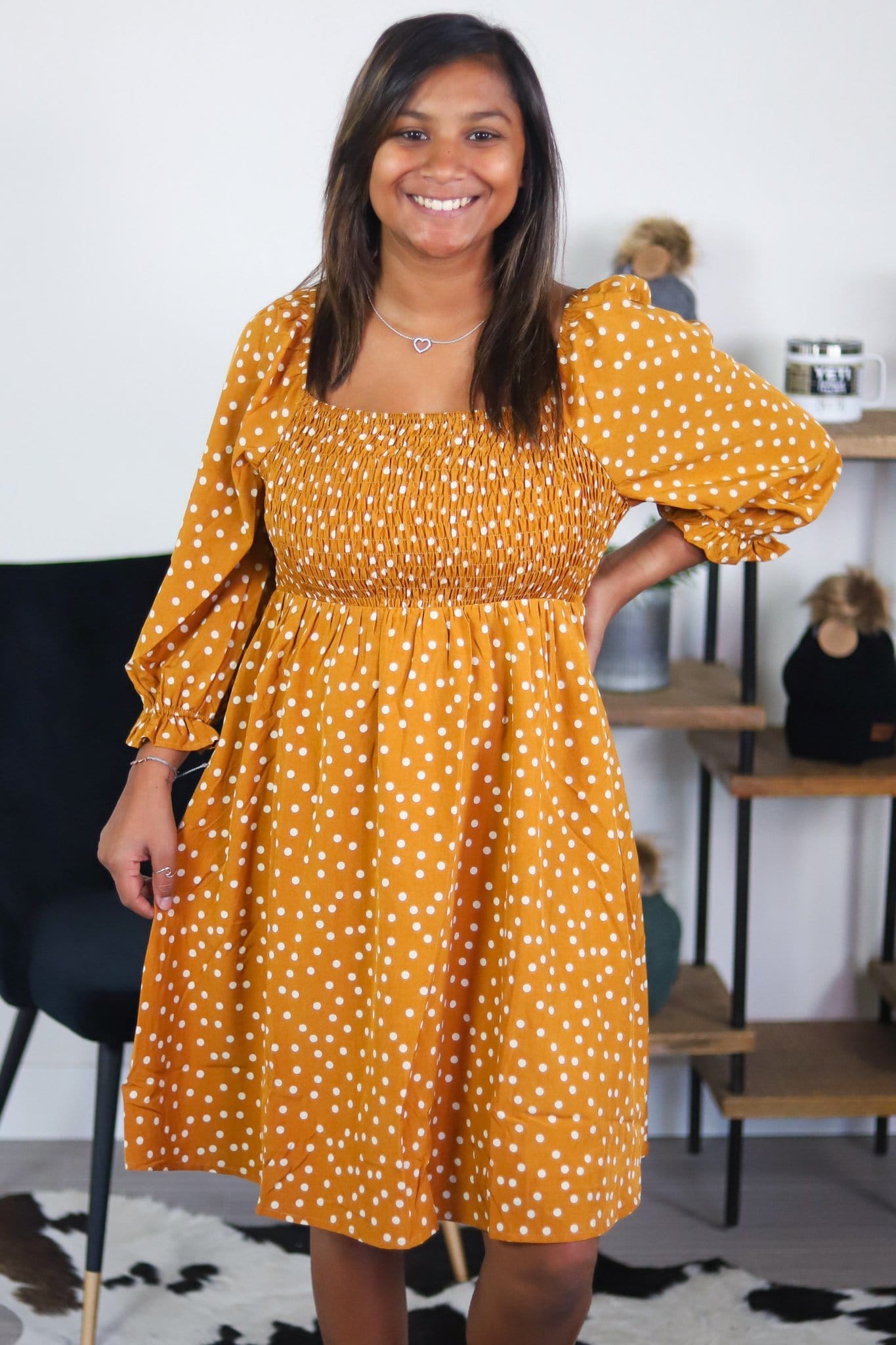 gold dress with white dots