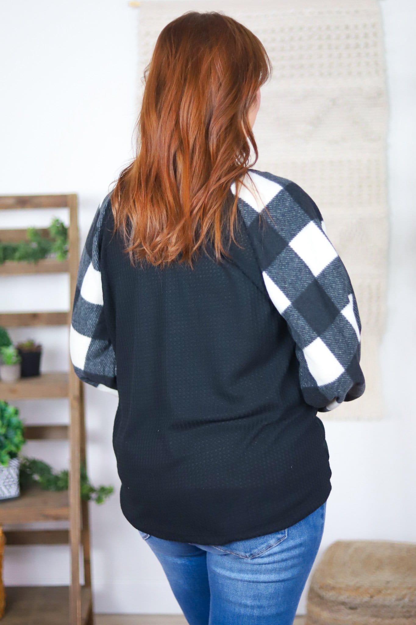 back of white black plaid sleeve