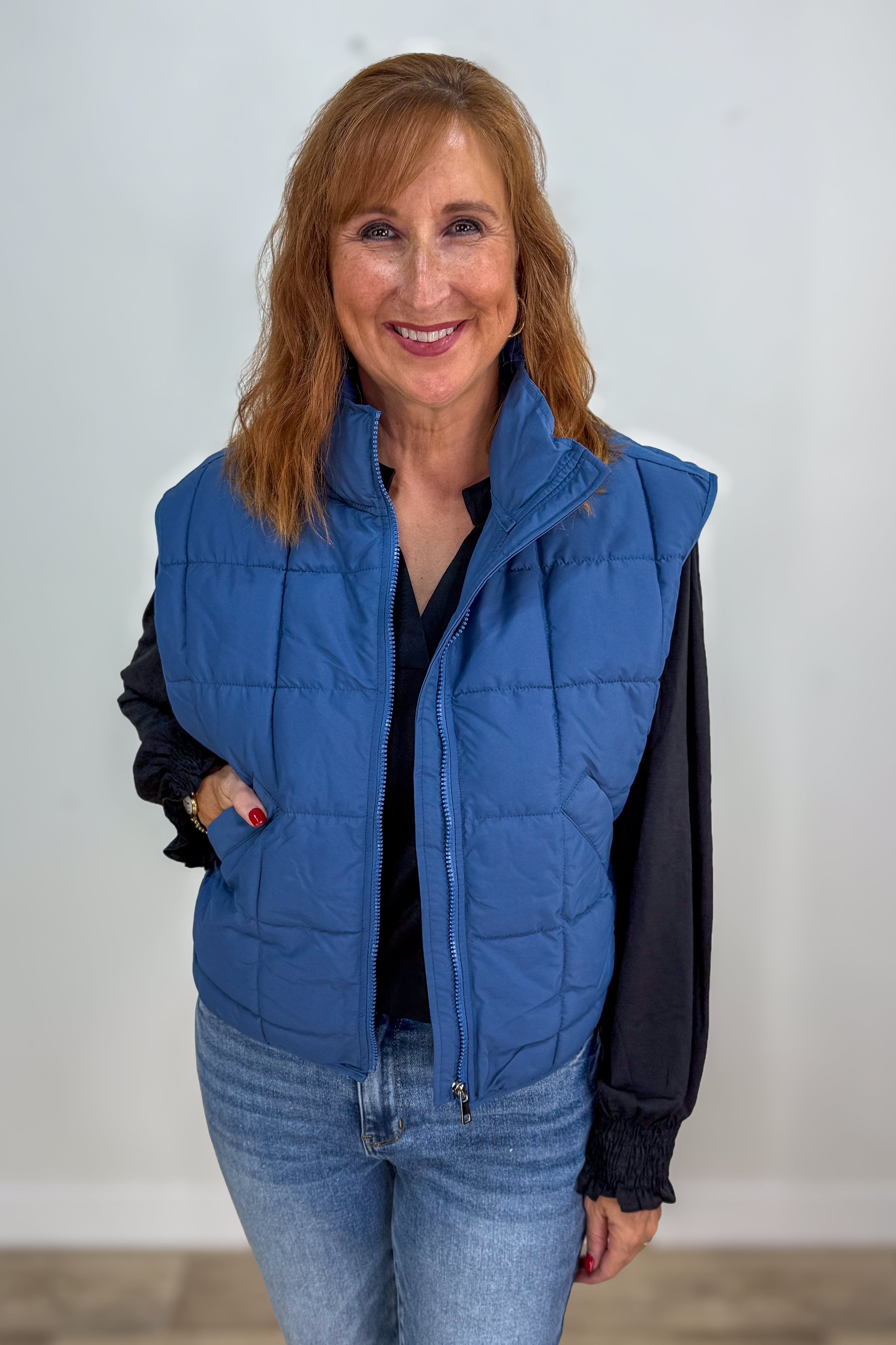 Black Solid Smocked Sleeve Lizzy Blouse styled with vest