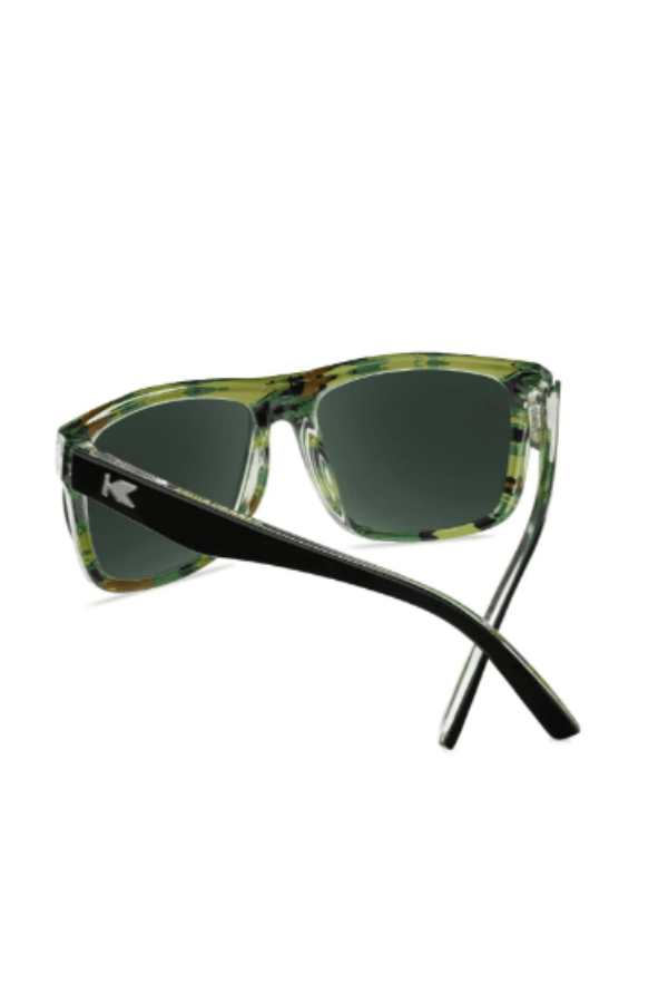 Sunglasses with a camouflage frame and black arms on a white background