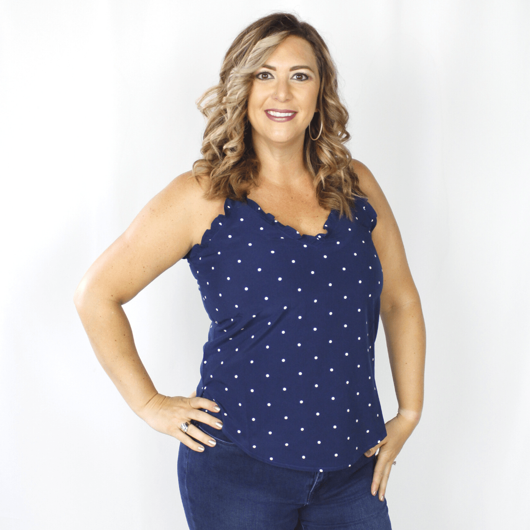 Navy polka dot tank top with ruffle neckline