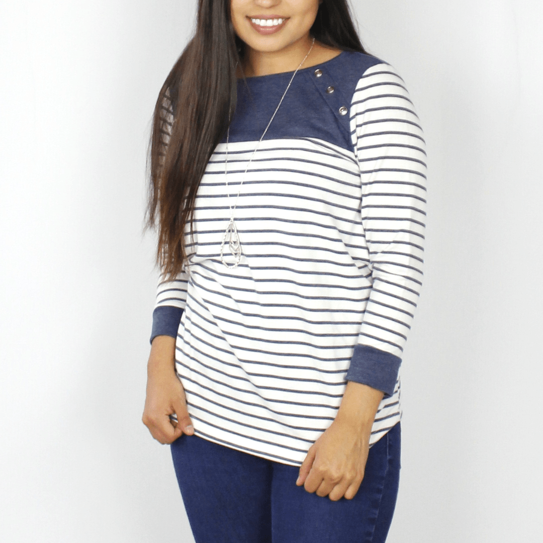 Black and white striped long sleeve, blue button accents