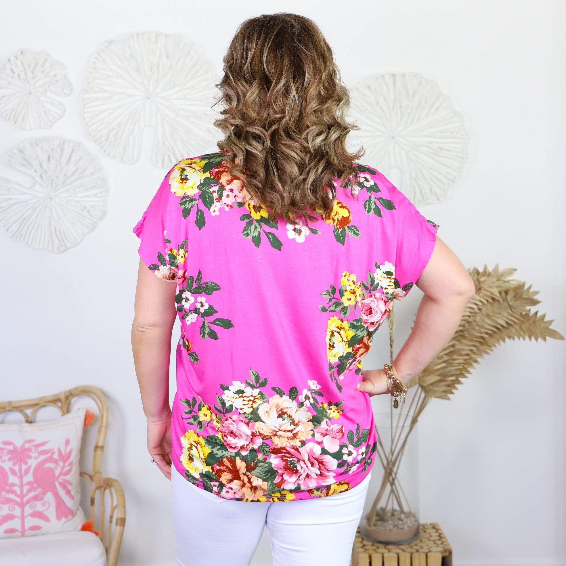 pink short sleeve shirt with colorful flowers