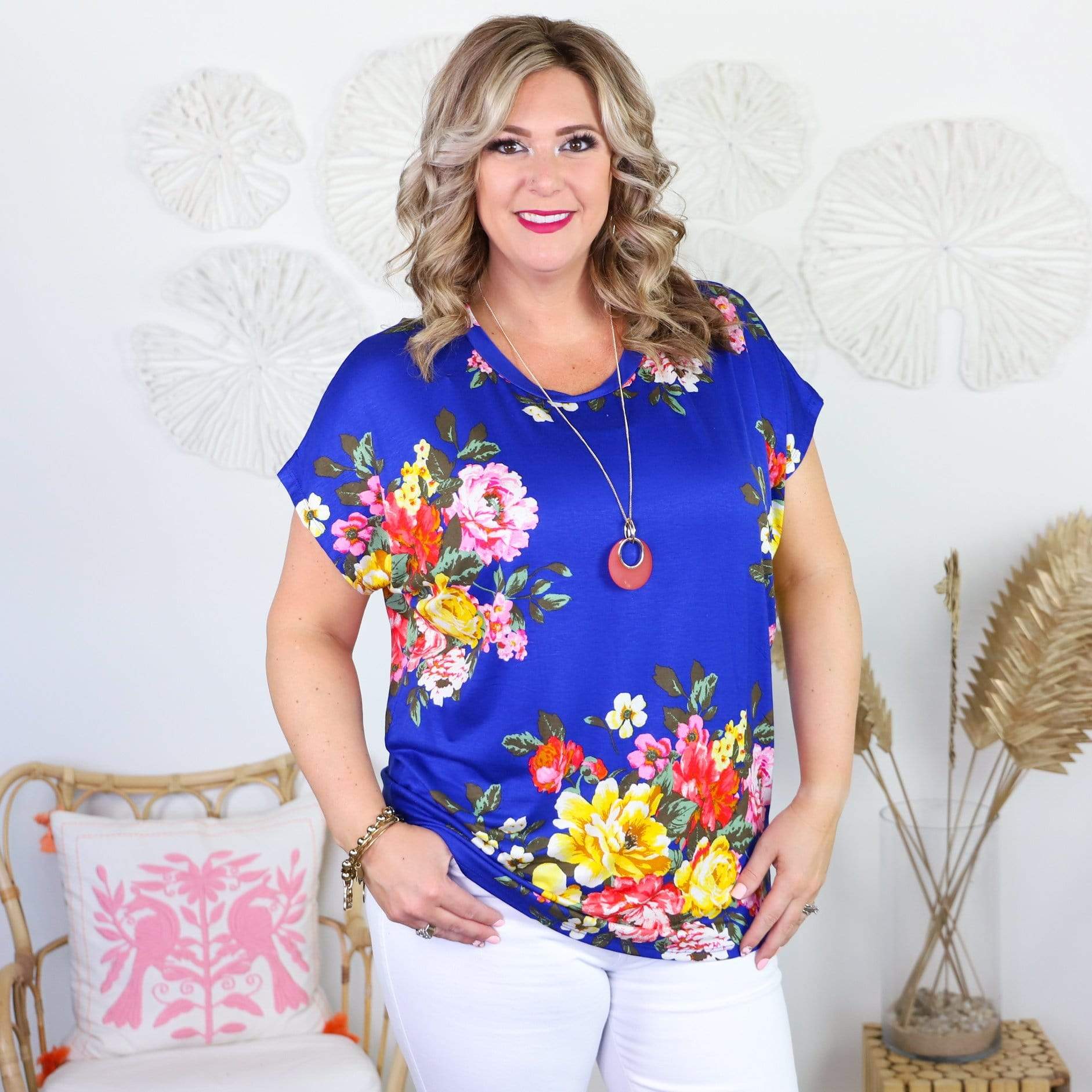 blue short sleeve shirt with colorful flowers  