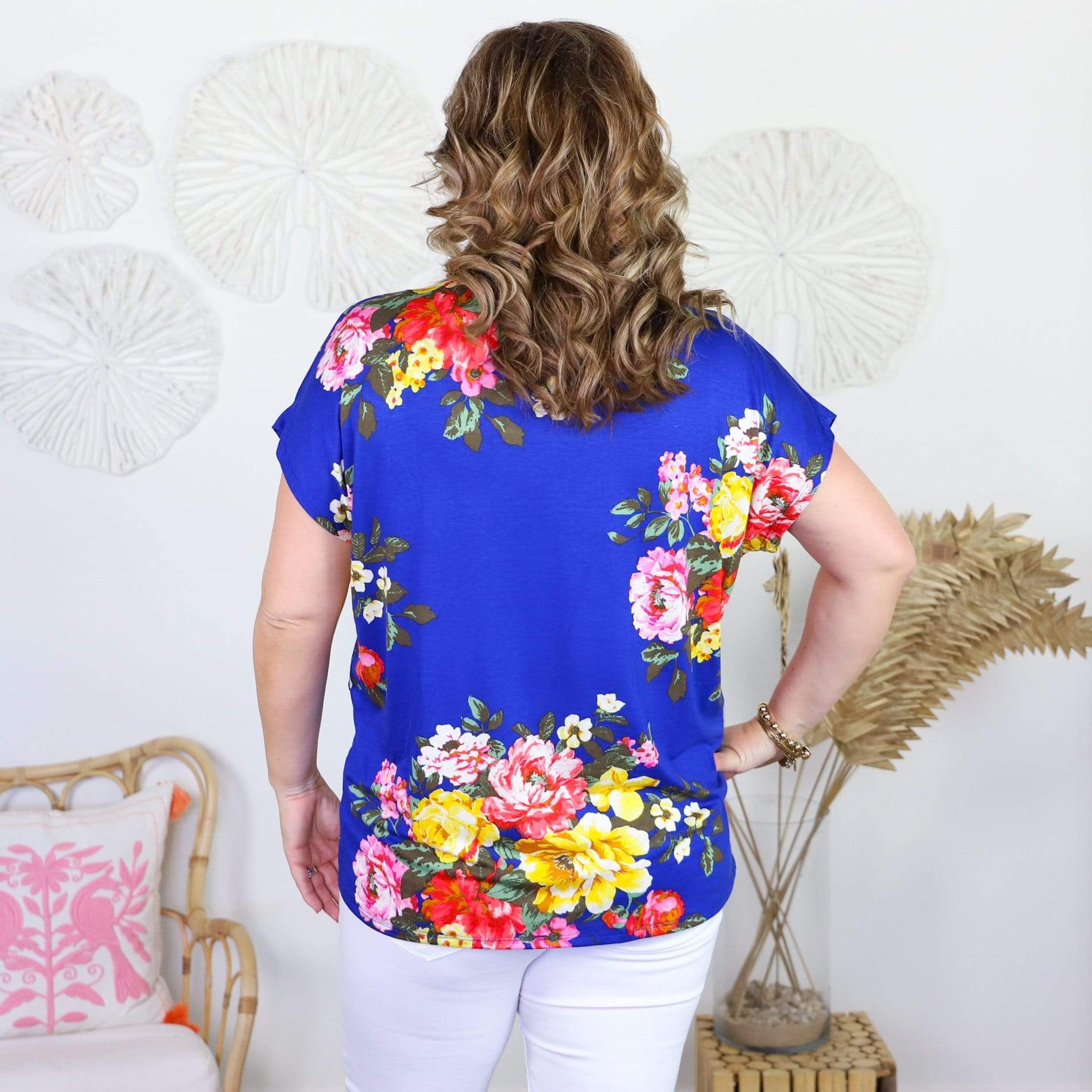 blue short sleeve shirt with colorful flowers