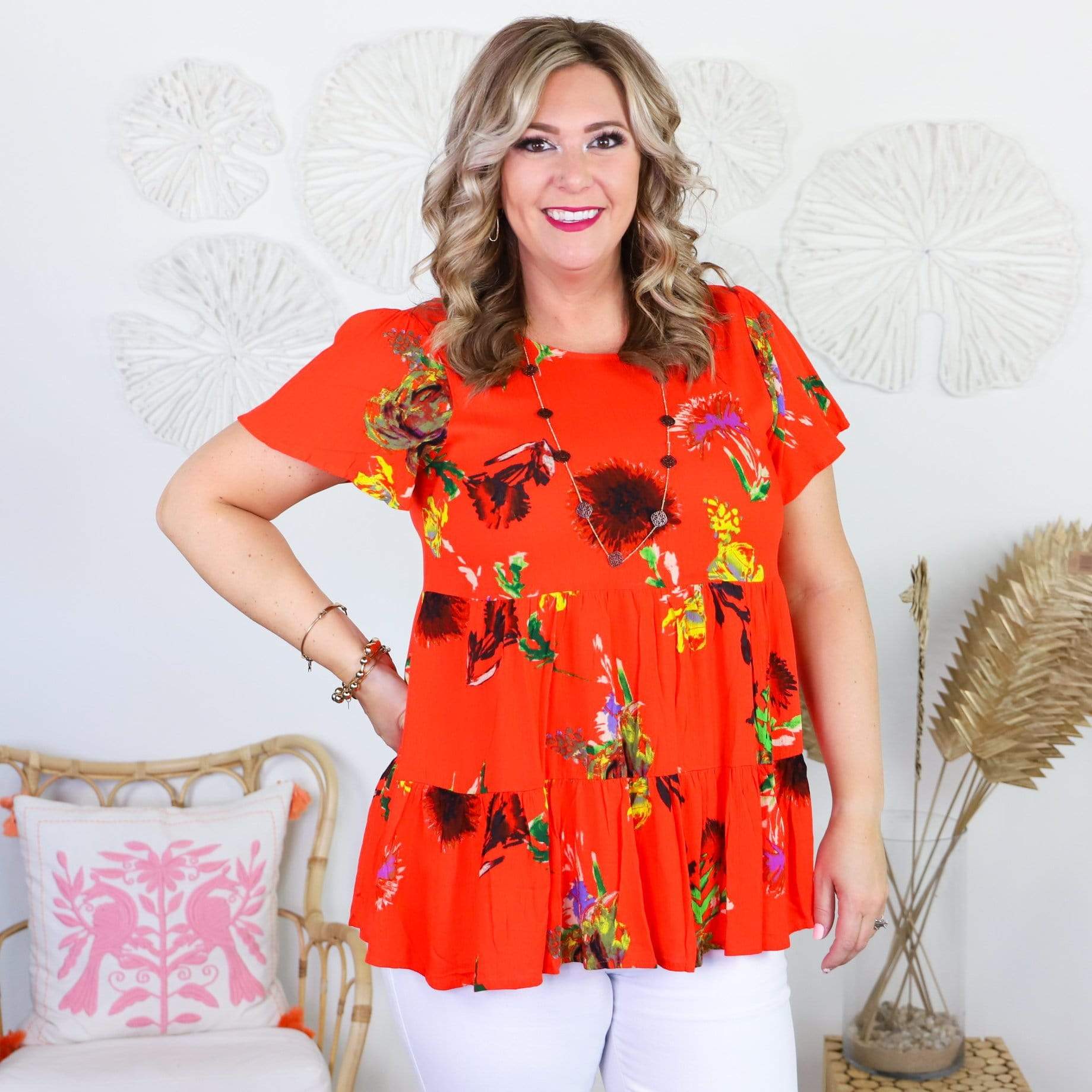 orange short sleeve shirt with colorful flowers