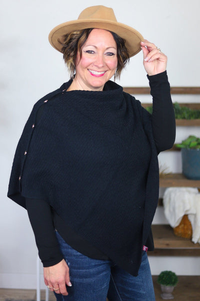 black textured poncho with buttons on side