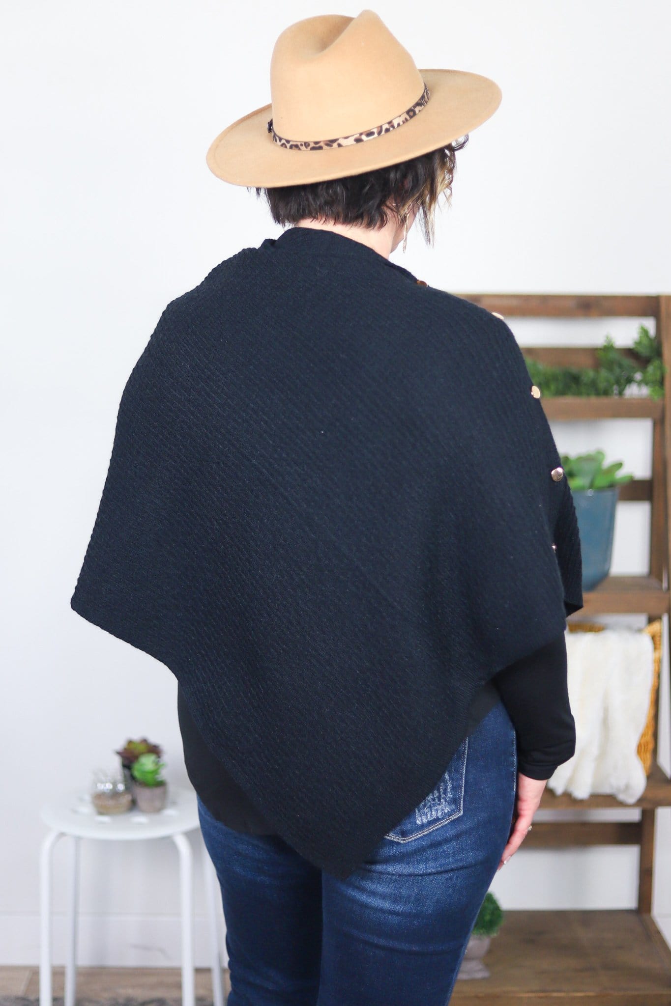 back of black textured poncho 