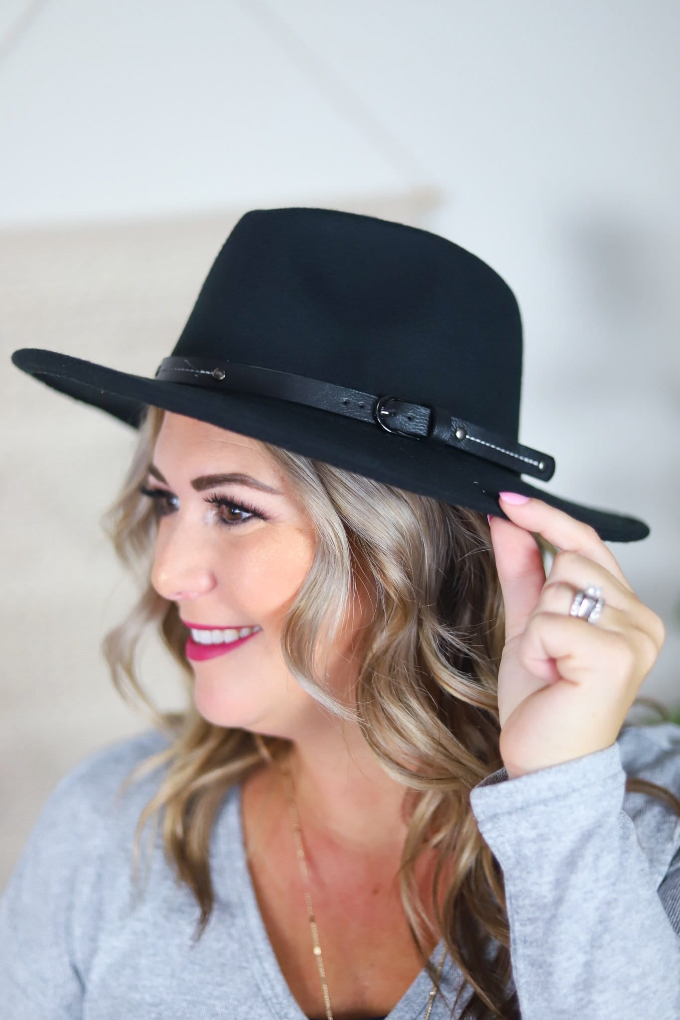cute hat with black strap and buckle