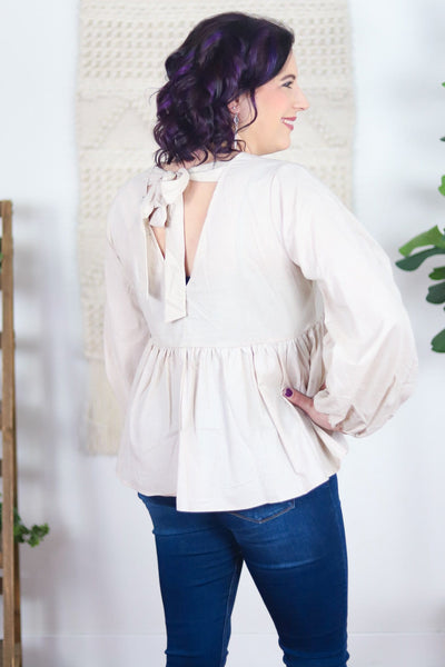 tied back light colored babydoll top