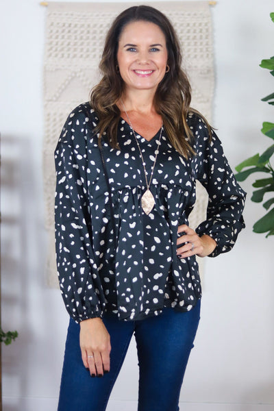 shiny blue black white spotted v-neck shirt