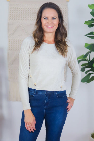 cream ribbed top with buttons on sides
