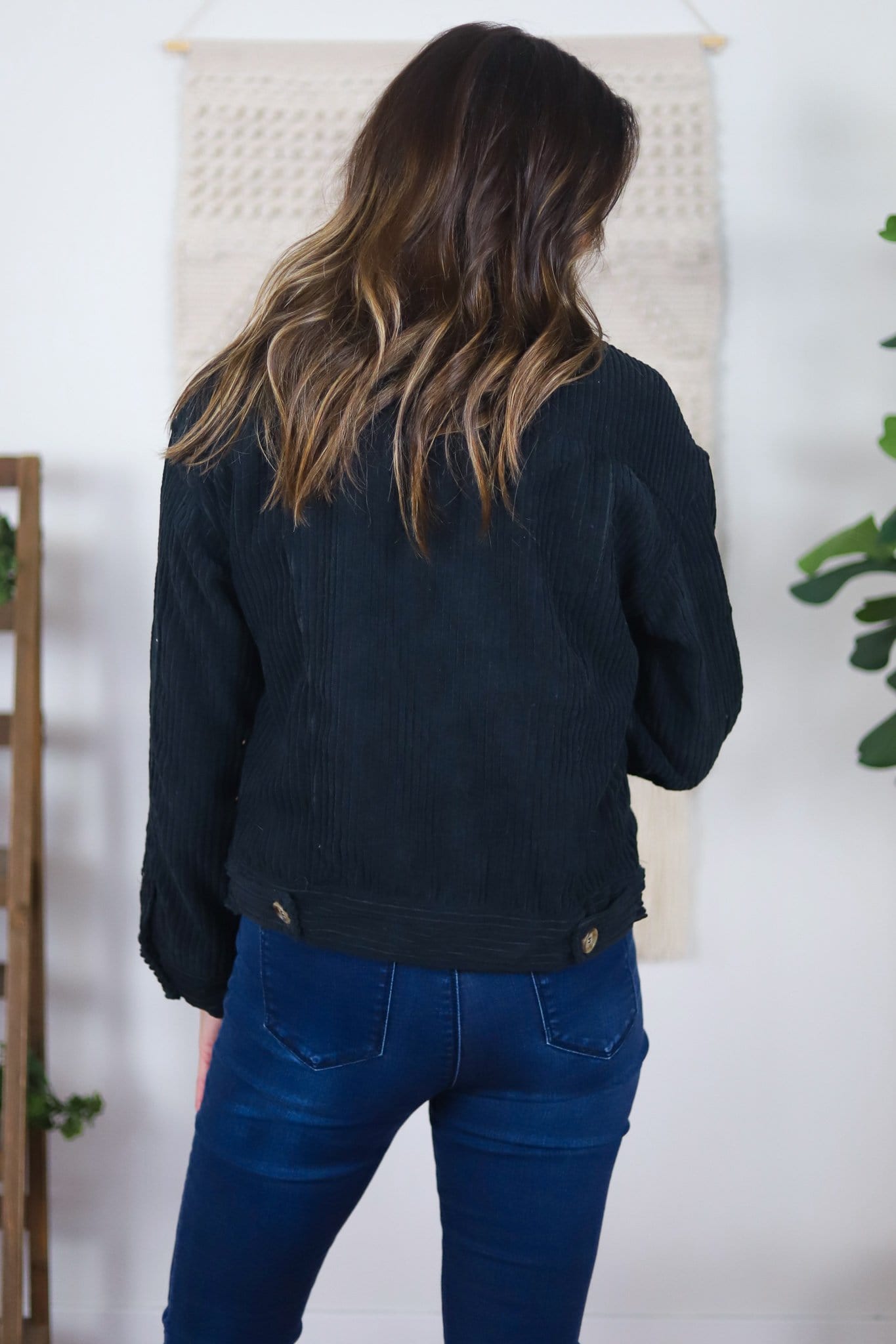 back of black corduroy jacket