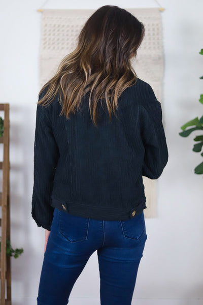 back of black corduroy jacket