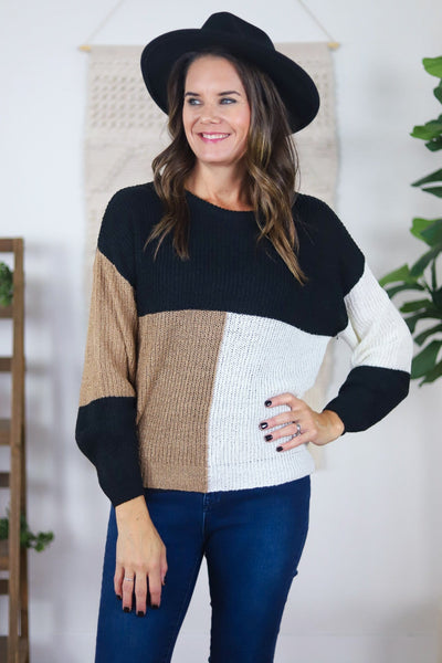 black tan and white tied back sweater