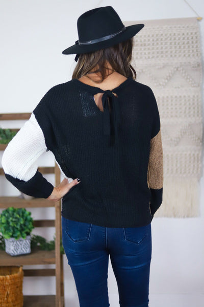 black tan and white tied back sweater 