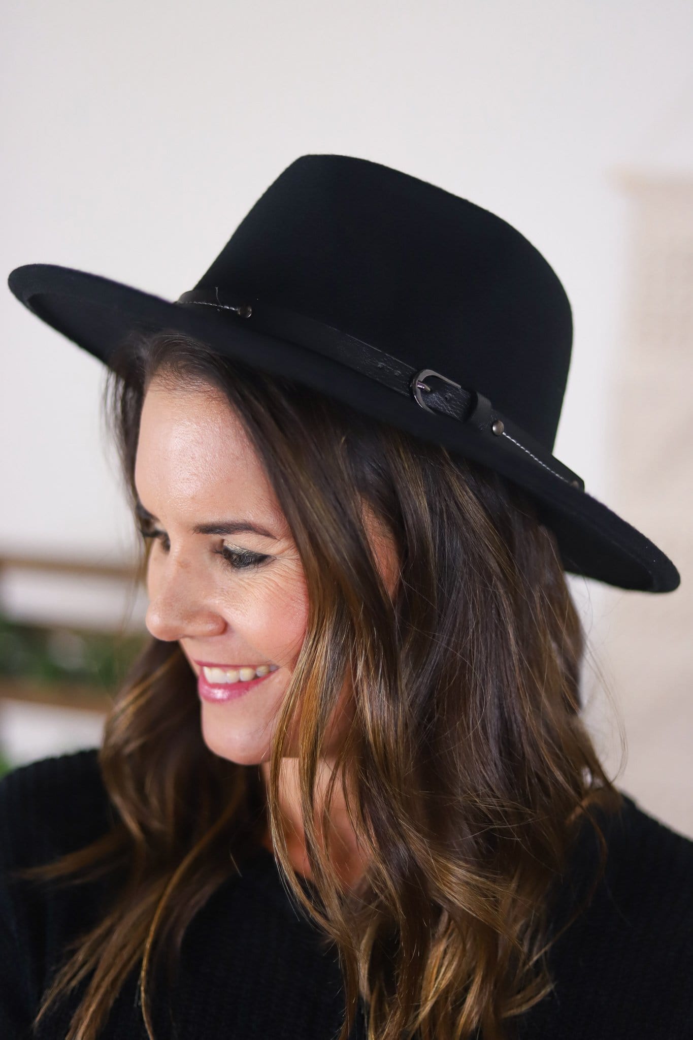 dark felted brimmed hat with buckle