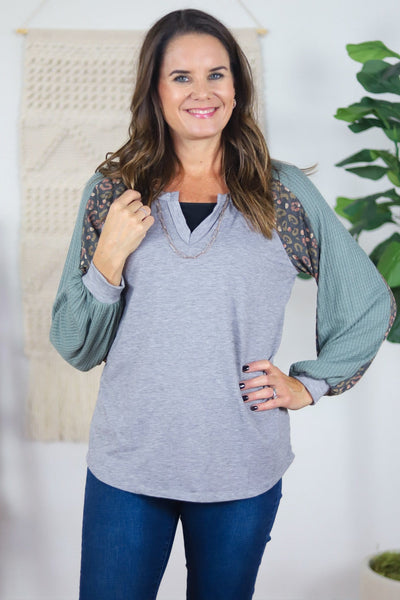 grey v-neck with colored textured and patterned sleeves