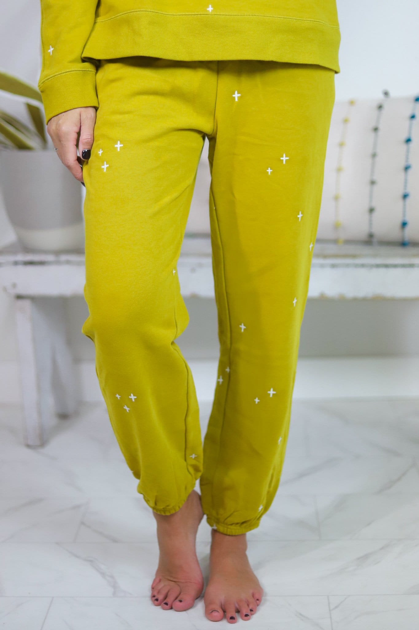 yellow pants with white star embroidered 