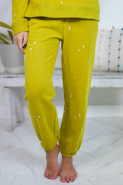 yellow pants with white star embroidered 