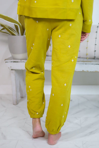 yellow pants with white pants embroidered back