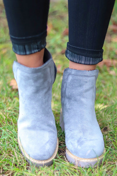 simple grey boots with yellow sole accent