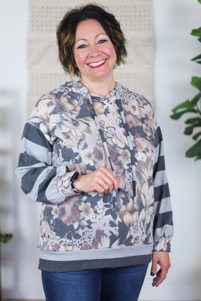 floral hoodie with grey striped sleeves and trim