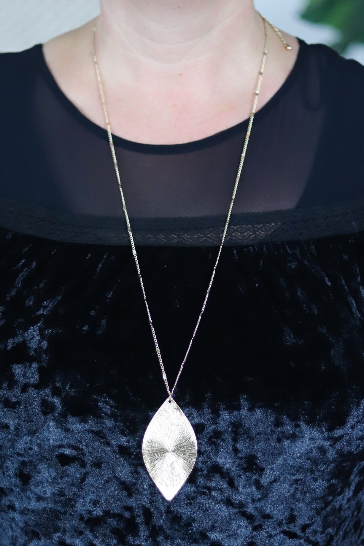 textured gold leaf shaped necklace 