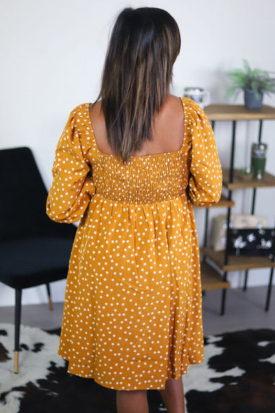 back of gold yellow dress with dots