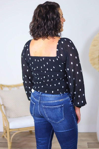 black polka dot top
