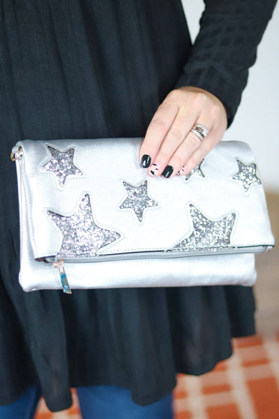 white fold over cross body star pattern bag