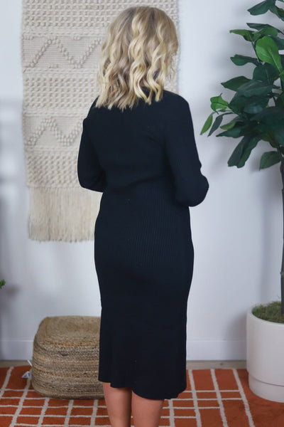 back of black button up dress