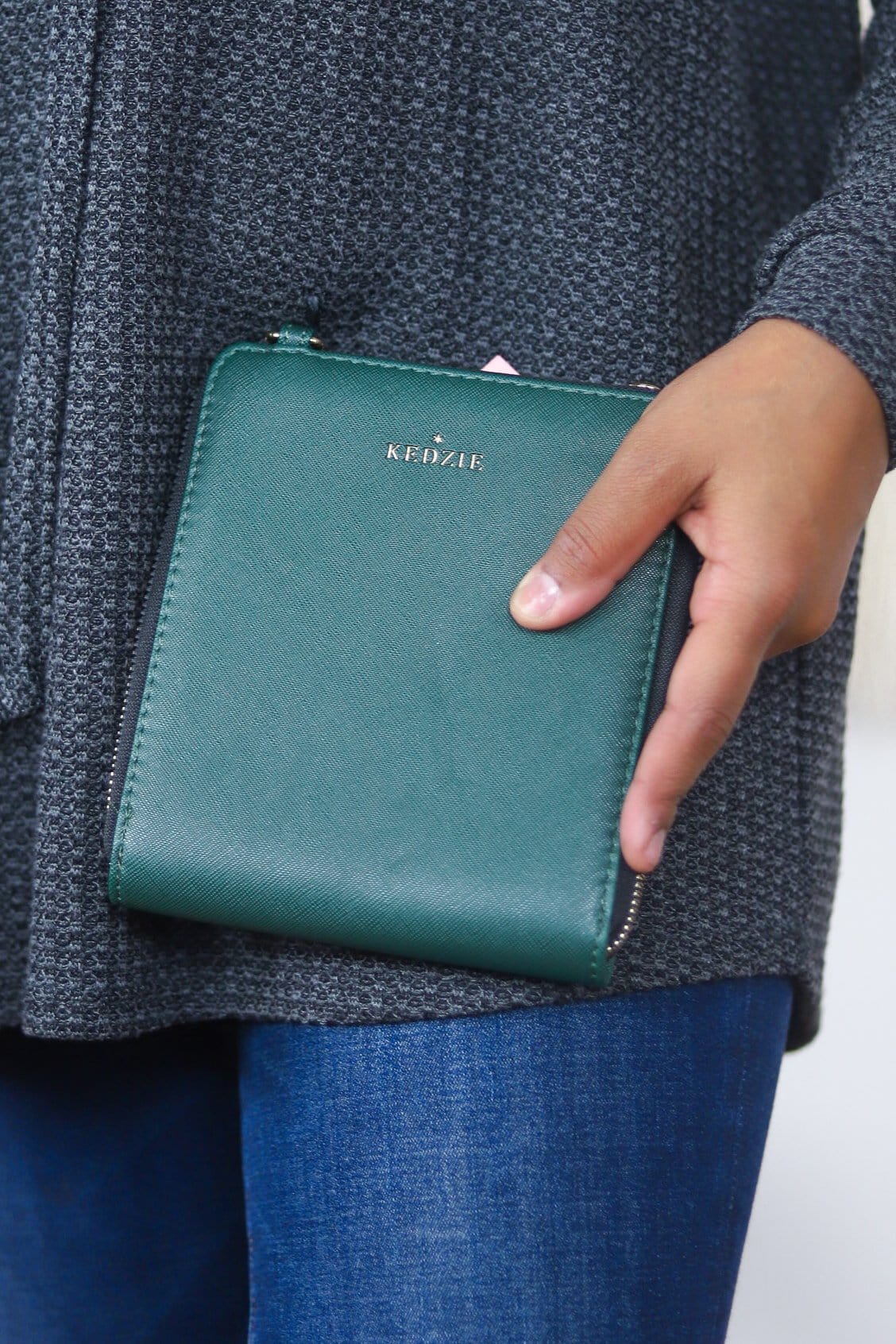 green little bag with black trim 